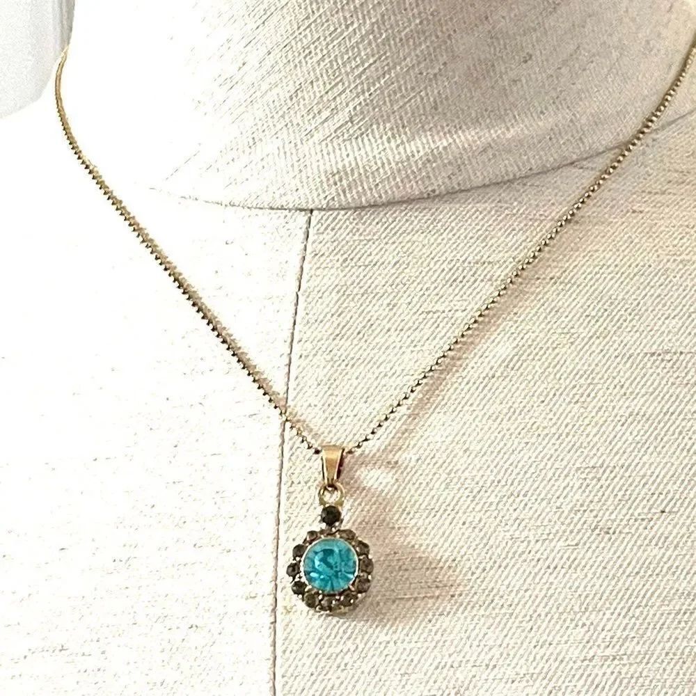 Gold tone Necklace with blue pendant
